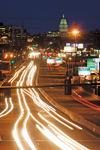 The State Capitol overlooks Denver’s freeway system.