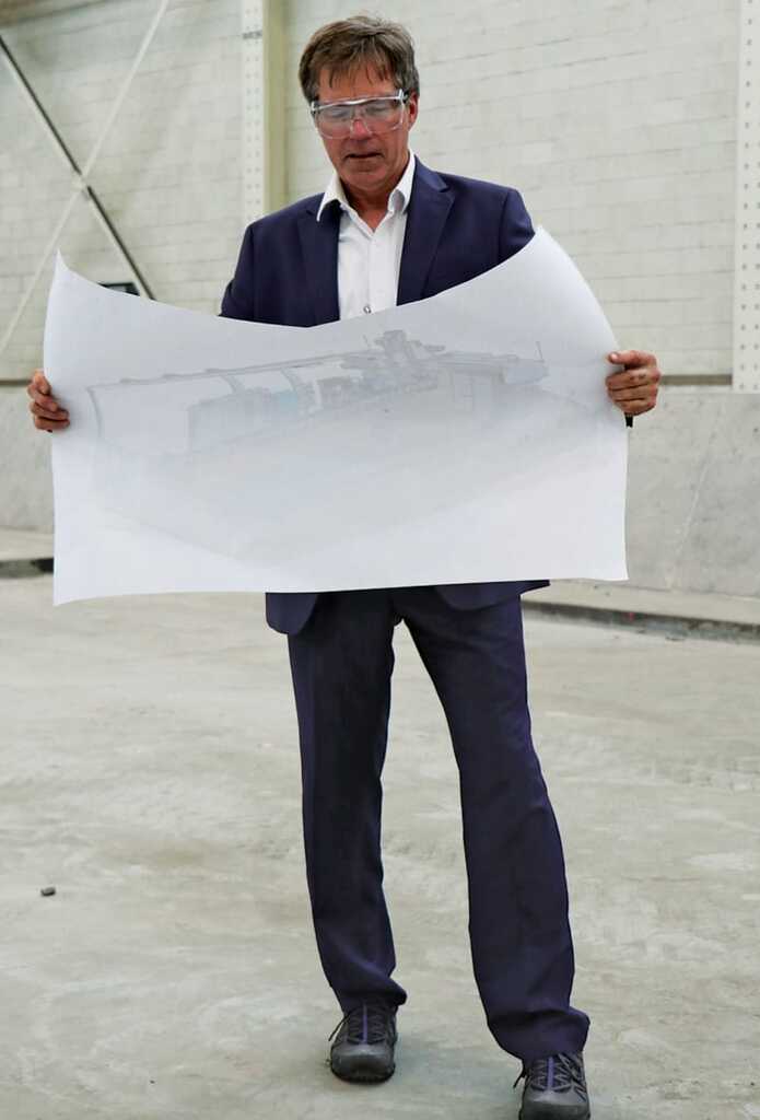 Ed Flinn, director of Advanced Manufacturing at Rock Island Arsenal-Joint Manufacturing and Technology Center, stands in May 2022 where the Jointless Hull Large Format Tool — the world’s largest metal 3D printer — will be installed. The center is a vertically integrated manufacturer capable of taking raw metal and pliable materials and creating a finished product in one location, and is dedicated to providing readiness to warfighters through its 16 major production capabilities.