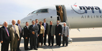 Members of the Des Moines City Council and Northwest Airlines officials