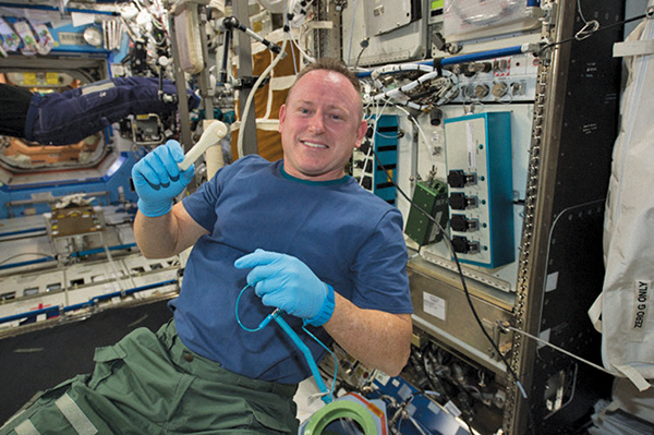 Astronaut Barry Wilmore and his new 3D-printed ratchet, courtesy of Made in Space’s additive manufacturing facility on the International Space Station.