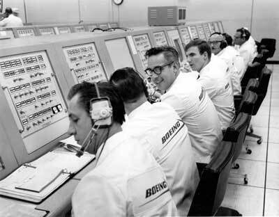 Boeing’s ties to Kennedy Space Center predate the complex receiving that name. Here a special Boeing crew dressed in “ice cream” suits monitors Saturn V launch preparations for Apollo. 