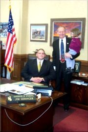 Gov. Jim Geringer (standing) and Rulon Gardner