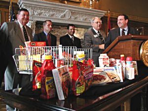 Gov. Mike Huckabee (far right) welcomed Nestle and congratulated Jonesboro