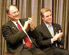 Michael Szymanczyk, left, and Gov. Mark Warner