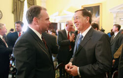 CEO James Guyette speaking with Gov. Timothy Kaine