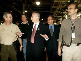 Gov. Bob Holden (pictured center while touring Ford's Kansas City-metro plant)