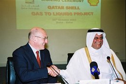 Sir Philip Watts (left) with Abdullah Hamad Al-Attiyah