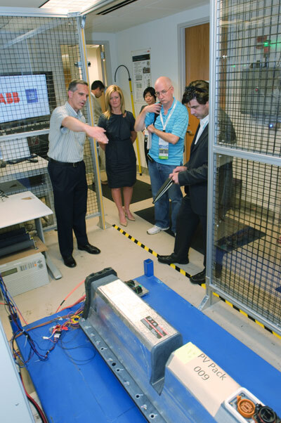 Pablo Valencia, GM's Senior Manager for Battery Lifecycle Management, describes the prototype developed by GM and ABB to prepare the battery system used in the Chevrolet Volt for potential secondary use applications to journalists who visited the ABB R&D office in Raleigh, N.C.