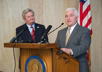 Gov. Jack Dalrymple (l.) and Badlands NGL CEO William Gilliam announce the company’s $4-billion investment in a polyethylene facility in North Dakota. The search for a final site continues.