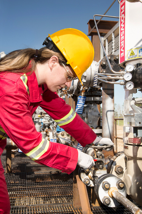 A Shell employee works in summer 2015 at a CO2 injection well that is part of the Quest Carbon Capture and Storage Project.
